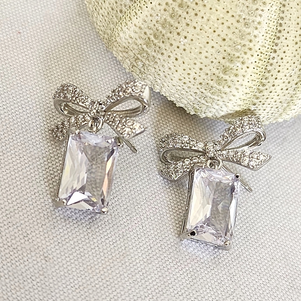 White Gold Bow with Drop Emerald Cut Clear Stone